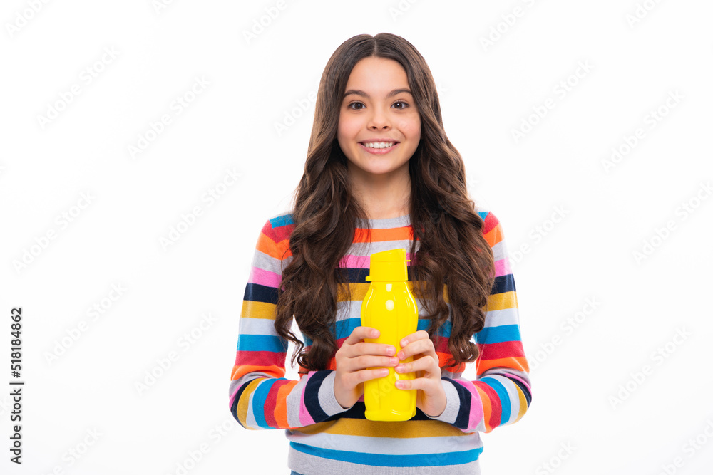 Child teen with water bottle isolated studio background. Water bottle and healthy life. Health and water balance. Happy girl face, positive and smiling emotions. Child teen with water bottle isolated studio background. Water bottle and healthy life. Health and water balance. Happy girl face, positive and smiling emotions.