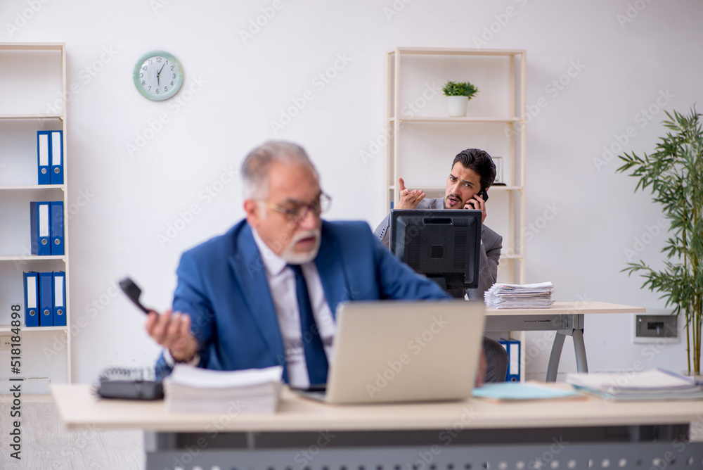 Two male colleagues working in the office Two male colleagues working in the office