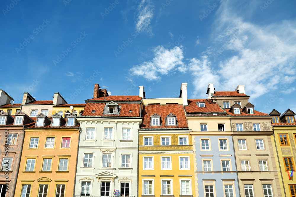 Fototapeta premium Colourful buildings of Warsaw's Old Town Market Square, which was completely destroyed during the World War II and later restored to its prewar appearance.