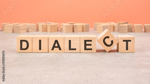 Dialect word written on wood block - text on wooden table for your desing, concept.