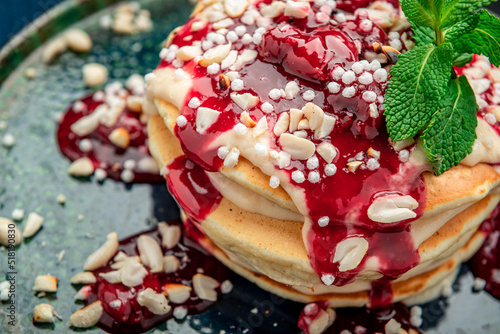 Pancake tower with yogurt, nuts and cherry jam