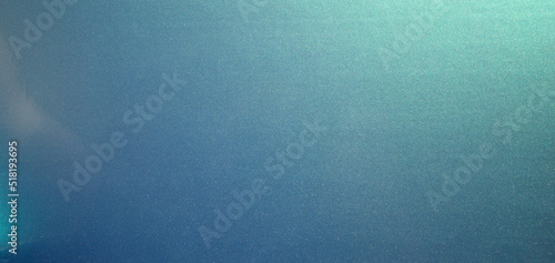 Photo of the texture of chameleon-colored vinyl film. Rectangular background the color of the sea breeze.