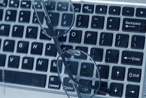 glasses on the keyboard, office