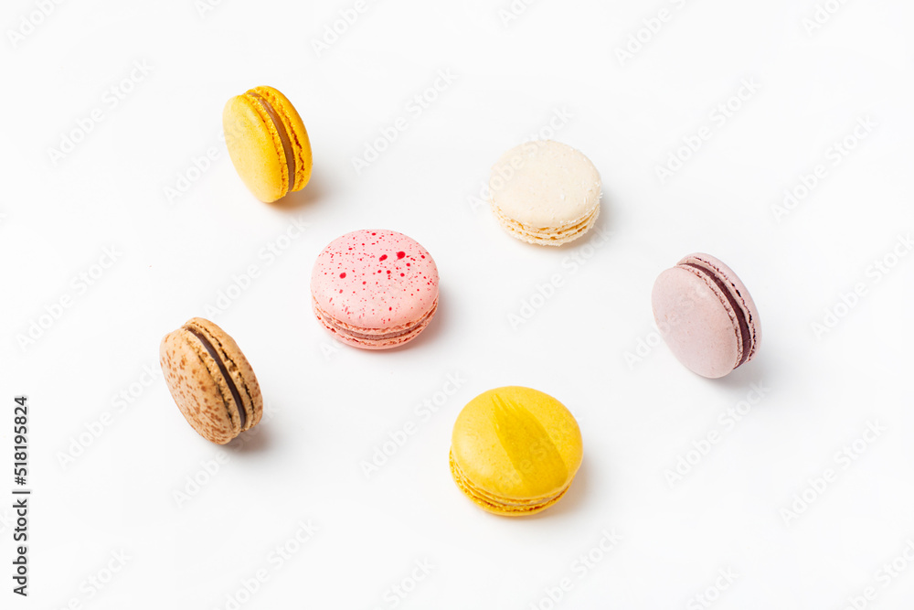 Macaroons sweet food on white background. Pastel yellow, pink color background. Macaroons sweet food on white background. Pastel yellow, pink color background.