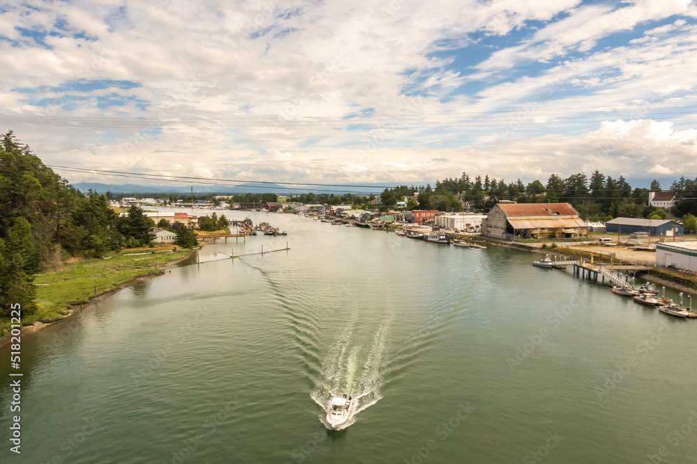 Boats in the Swinomish Channel where it passes through the town of La Conner, in Washington State's Skagit Valley in July.  Room for text