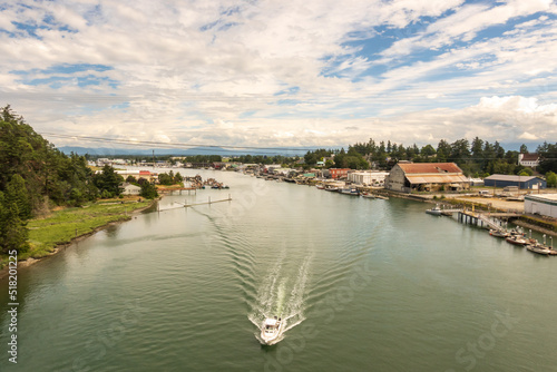 Boats in the Swinomish Channel where it passes through the town of La Conner, in Washington State's Skagit Valley in July.  Room for text photo