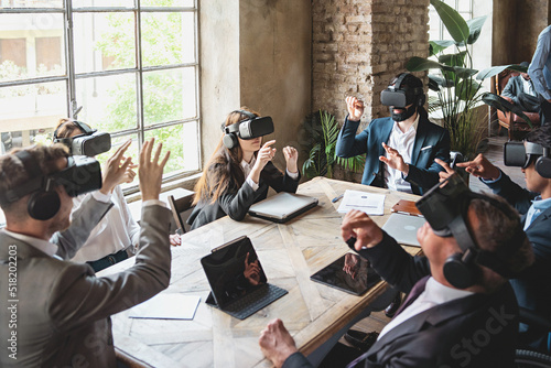 Businesspeople meet in the metaverse for a project presentation using VR 360 goggles - Combining business and technology in the virtual world photo