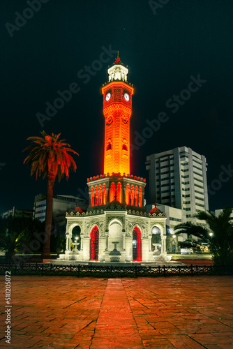 Night shot of Izmir watch tower with beautiful red and orange lighting on the tower. © Vahid