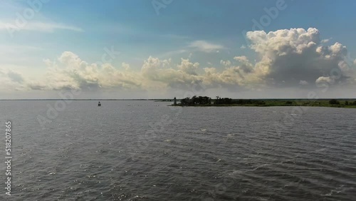 Flying Drone over Water toward a Lighthouse on Lake Pontchartrain
 photo