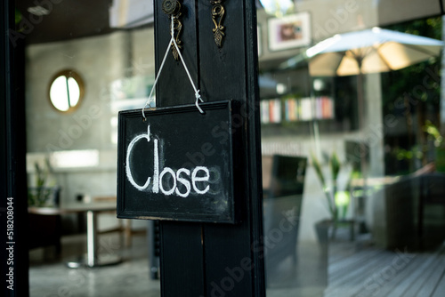 close label on wood door with blur background
