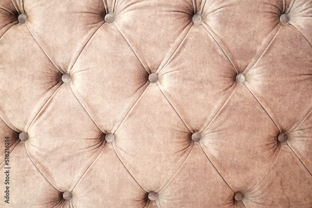 Fototapeta premium Background texture of draped sofa back with velveteen and buttons. Abstract interiors backgrounds