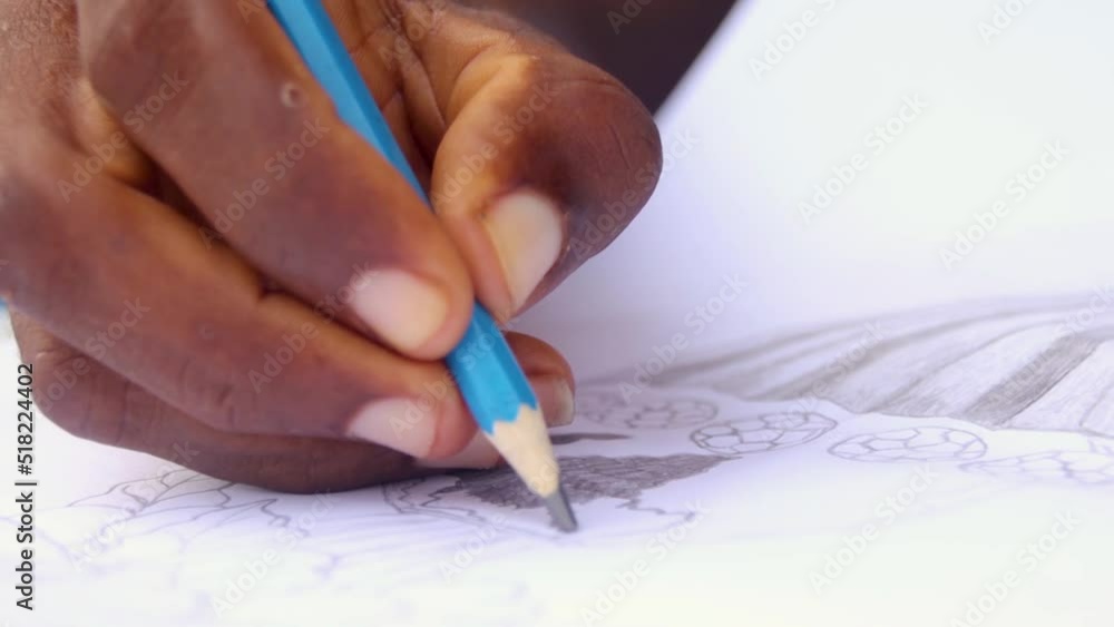 Hand of a person drawing and shading a pencil art Hand of a person drawing and shading a pencil art