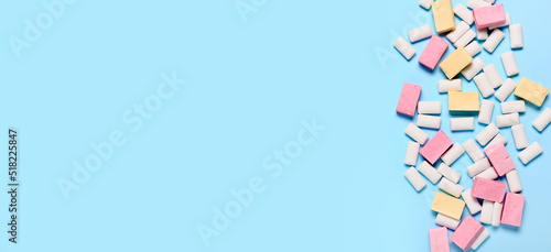 Tasty chewing gums on blue background with space for text © Pixel-Shot