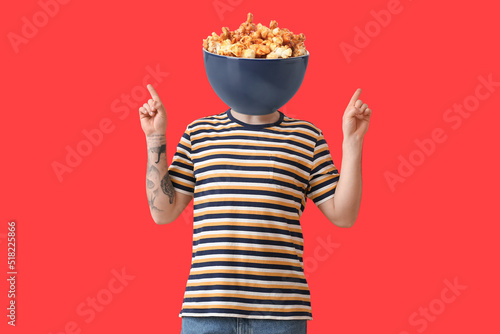 Young man with bowl of swee...