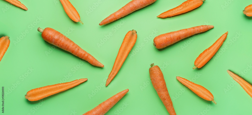 Many fresh carrots on green background Many fresh carrots on green background