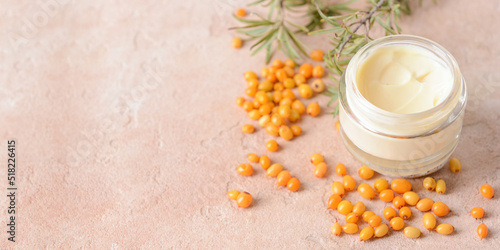 Принти на полотні Jar of healthy sea buckthorn cream on pink background with space for text