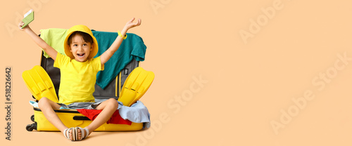 Little boy with passport an...
