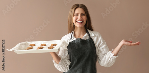 Beautiful female baker hold...