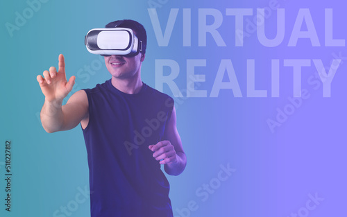 Young man with VR glasses a...