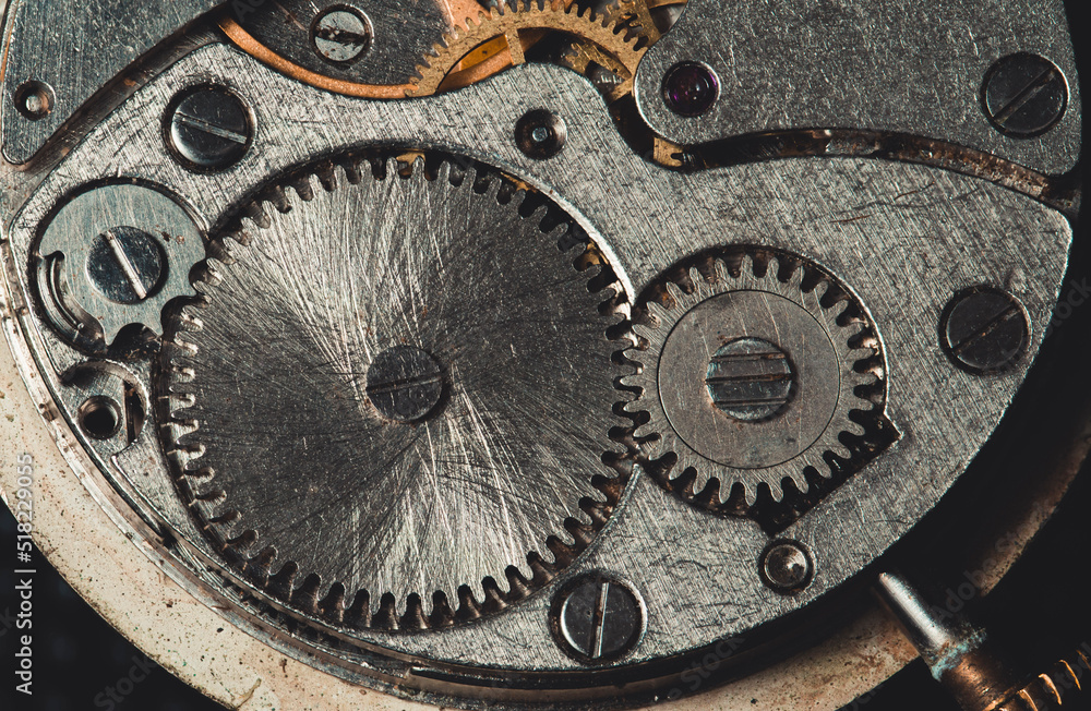 The mechanism of an antique clock close-up