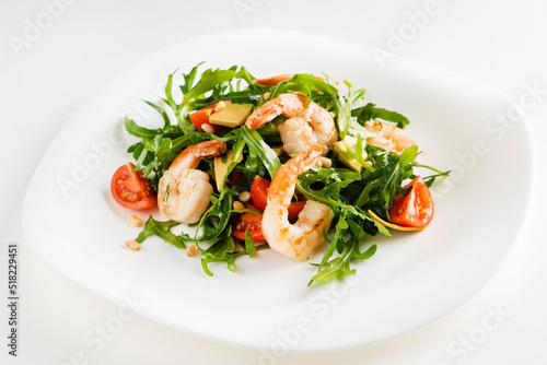 salad with shrimps, rocket salad and cherry tomatoes