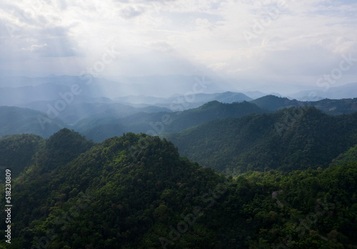 Top view Landscape of Morning Mist with Mountain Layer at north of Thailand. mountain ridge and clouds in rural jungle bush forest © freedom_naruk