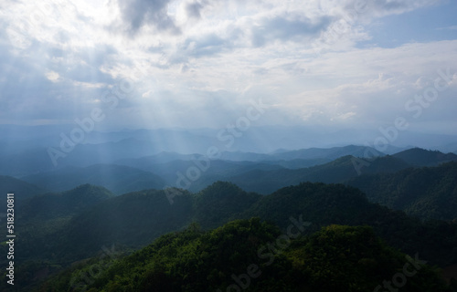 colorful dramatic sky with cloud at sunset. morning fog in dense tropical rainforest