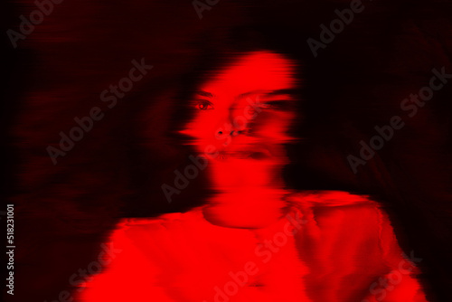 Fantasy, illusion and sci-fi concept. Abstract beautiful woman portrait in red neon futuristic glitch glowing hologram effect. Bright vivid filter applied. Pixel stretch and motion blur effect photo