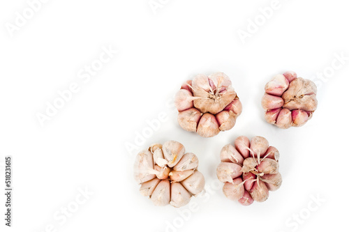 Several large heads of garlic, shot against a white background.