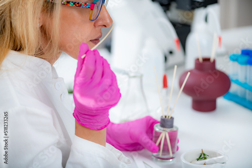 Bilde på lerret Perfumer Holding a Stick with Aromatic Oil.