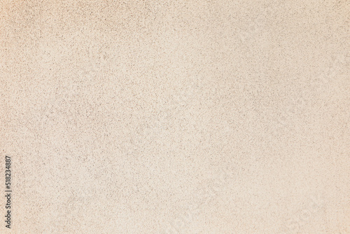 Texture of beige plaster wall as background photo