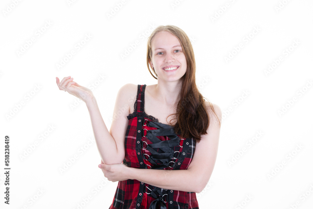cute pleased woman shows store promo deal smiles positively points at copy space isolated over white background cute pleased woman shows store promo deal smiles positively points at copy space isolated over white background