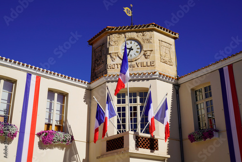 french flag city hall red white blue decoration in facade in town center photo