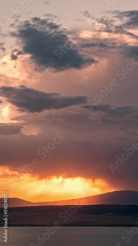 Wallpaper Mural Timelapse of sunset glowing in the sky as storm rolls in at dusk overlooking Utah Lake during summer monsoon. Torontodigital.ca