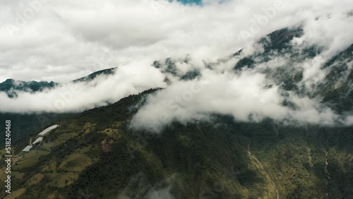 Tungurahua Stratovolcano Shrouded By White Clouds In Cordillera Oriental Of Ecuador. - wide photo