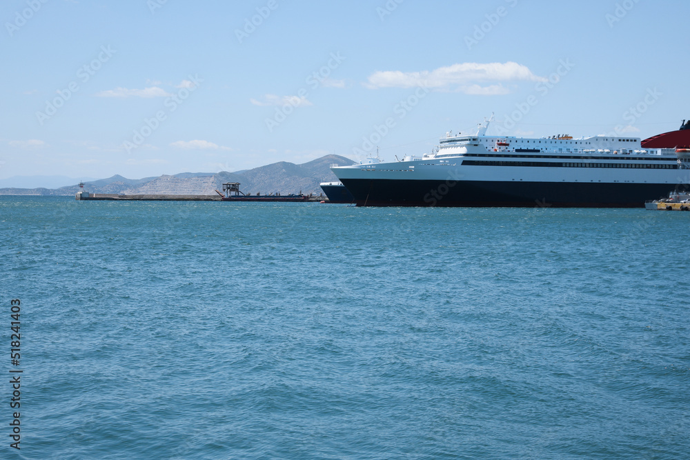 Modern ferry in sea port on sunny day