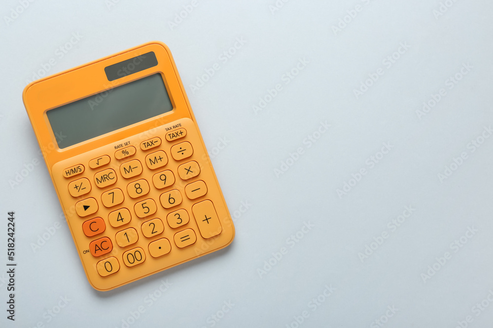 Orange calculator on light background, top view. Space for text Orange calculator on light background, top view. Space for text