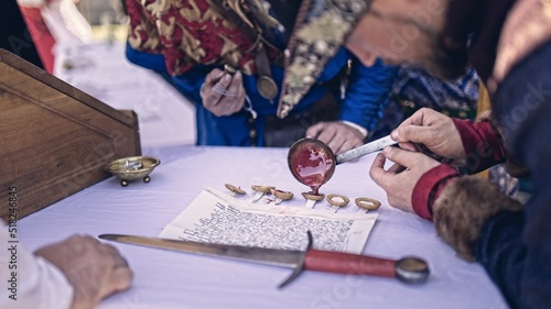 Sealing important document in 14th century - reenactment event