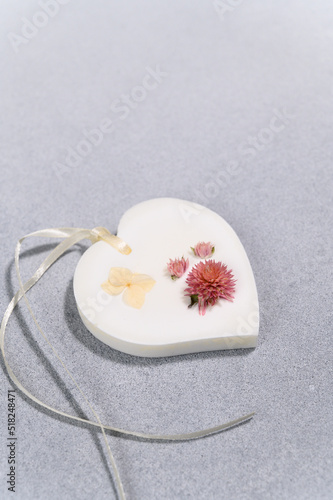 Wax Sachet in Form of Heart with Dried Flowers Close-up. Product Photography.