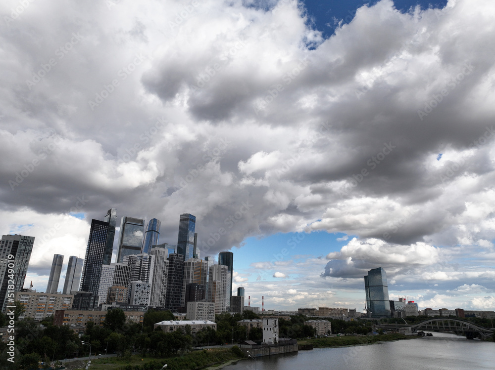 Fototapeta premium urban landscape with high-rise buildings and a panoramic view of the city on a summer day taken from a drone