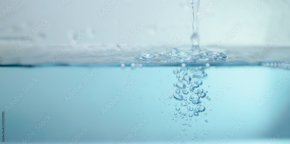 de-focused. Closeup of light blue transparent clear calm water surface texture with splashes and bubbles. Trendy abstract summer nature background. for a product, advertising,text space. de-focused. Closeup of light blue transparent clear calm water surface texture with splashes and bubbles. Trendy abstract summer nature background. for a product, advertising,text space.