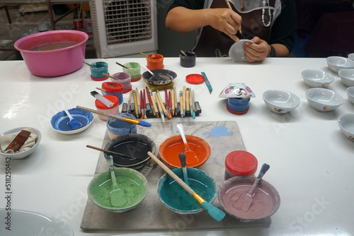 many beautiful color for painting with overglaze color stain which is food safety on the ceramic bowl. photo