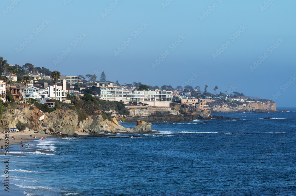 People relaxing on the beach on a sunny day in California People relaxing on the beach on a sunny day in California
