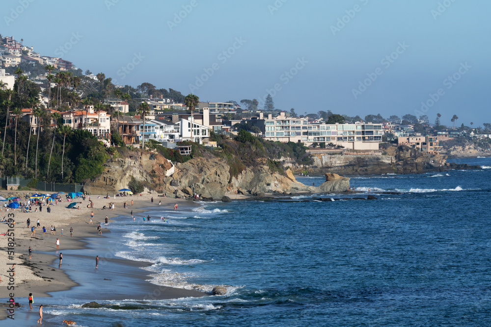 People relaxing on the beach on a sunny day in California People relaxing on the beach on a sunny day in California