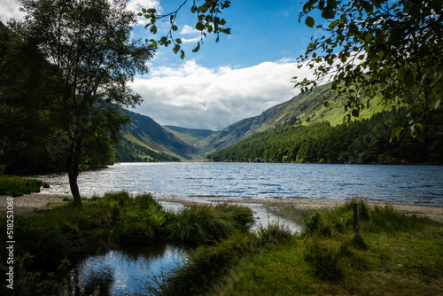 The upper lake in Glendalough. this body of freshwater is in a glacial valley in Co. Wicklow Ireland not far from Dublin and is a popular beauty spot enjoyed by tourists hiking walking sightseeing 