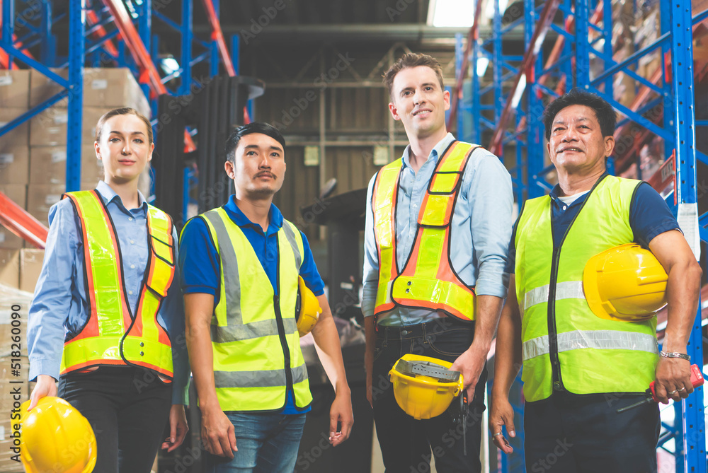 Portrait of successful logistics warehouse workers team, Group portrait of industry workers, Workers in hardhat helmet at workplace Portrait of successful logistics warehouse workers team, Group portrait of industry workers, Workers in hardhat helmet at workplace