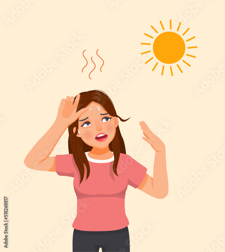 Beautiful young woman suffering from heat wave stoke in very hot weather temperature because of global climate change