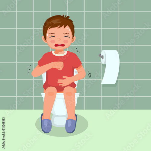 cute little boy sitting on toilet bowl in pain suffer from stomach ache having diarrhea constipation digestive problem