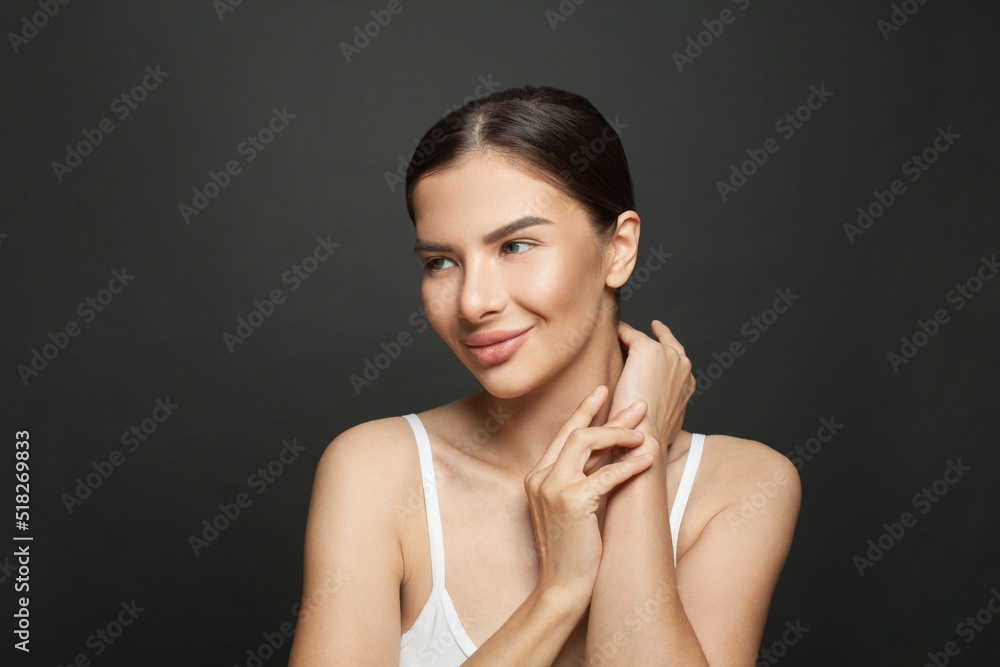 Portrait of spa woman brunette with clean skin posing on black background Portrait of spa woman brunette with clean skin posing on black background