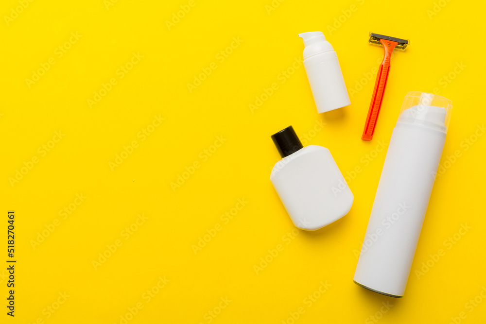 shaving man set. shaving machine, towel, lotion and shaving foam on colored background. Men bath Accessories top view
